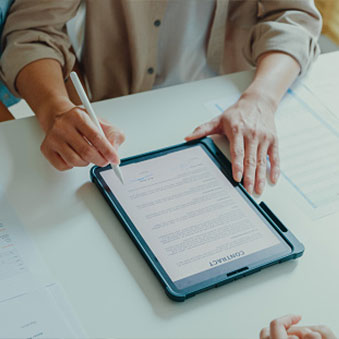 person reviewing documents about to sign